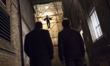 Ha. “What’s up?” Because he’s tied to some scaffolding in an alley. Hilarious.